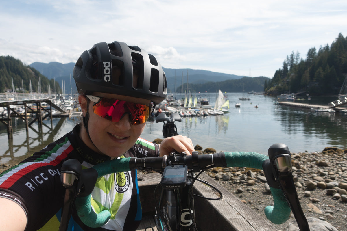 Photo of Joanne Hastie road cycling and visiting Deep Cove and took a reference photo for the painting Deep Cove.